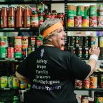Sister Rita Malavisi stacking the shelves in the ASRC Foodbank.