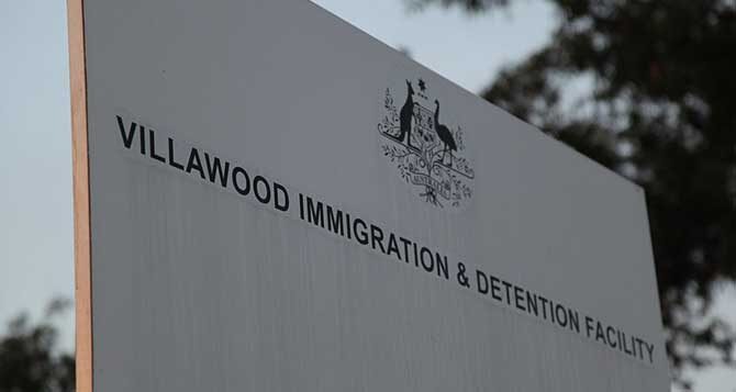 People must be immediately released from immigration detention as another worker tests positive for COVID-19